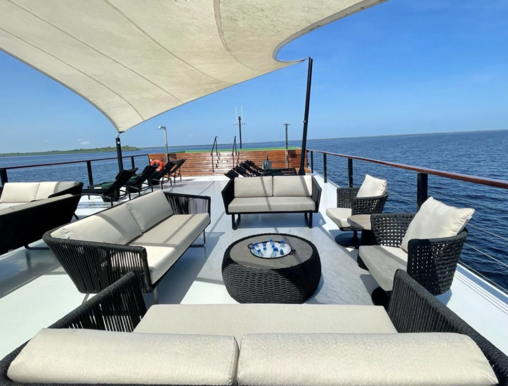 Luxury Amazon river deck with shaded lounge chairs, used on Kraken’s expedition mothership